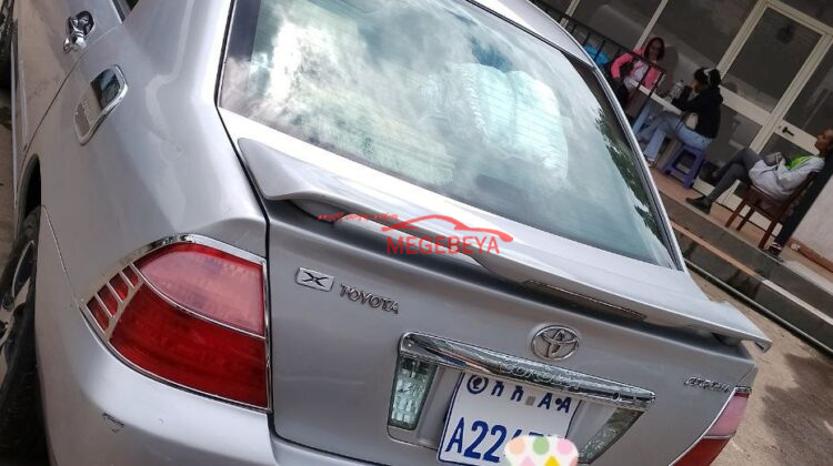hybrid car for rent Toyota Corolla (E120) 2005(አውቶማቲክ ማርሽ መሪ ያልዞረ አውቶሞበል 1.3 ሊትር ) is a series of compact Sedan cars