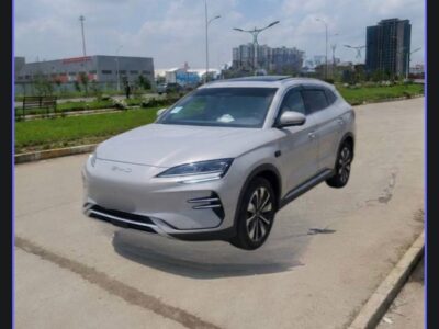 Image 1: Front three-quarter view of the 2025 BYD Song Plus EV in Time Grey parked in Addis Ababa.