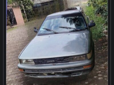 Front view of metallic silver 1991 Toyota Corolla XL E90 Hatchback parked in Addis Ababa