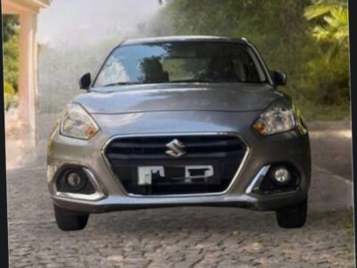 1.Alt Text: Front grille and bumper view of a silver Suzuki Dzire Addis Ababa car