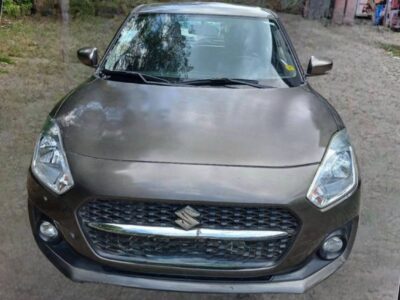 Image 1 (photo_2026-09-28_17-48-34.jpg): Front view of Suzuki Swift rental Addis Ababa 2023 automatic car