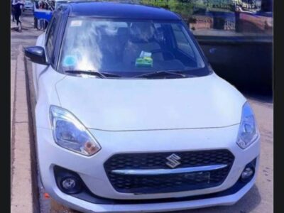 Image 1 (Front View): Alt Text: 2024 Suzuki Swift A2L Pure White Pearl front exterior view in Addis Ababa Ethiopia