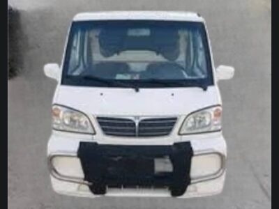 4: Front grille and headlight view of white CMC Veryca A180 commercial microvan