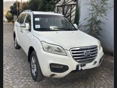 Image 3 (Lifan X60 (4).jpg): Front view of a white 2012 Lifan X60 showing the chrome front grille, halogen headlights, and front bumper