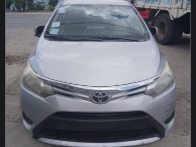Image 4 (TOYOTA YARIS (XP150).jpg): Front exterior view of the silver Toyota Yaris rental highlighting the grille and headlights.