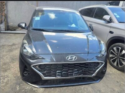 1:Front view of 2023 Hyundai i10 in Titan Grey Metallic parked outdoors in Addis Ababa