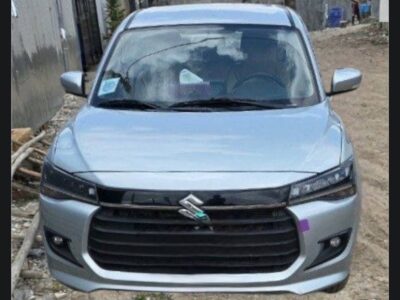 1:Front exterior view of 2025 Suzuki Dzire Smart Hybrid in Silky Silver Metallic for sale on Megebeya