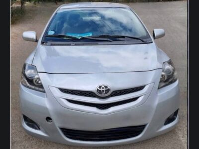 1:Front exterior view of 2005 silver Toyota Belta XP90 sedan for sale on Megebeya Ethiopia