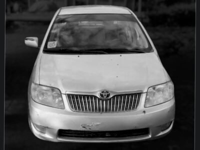 1:Front exterior view of silver 2006 Toyota Corolla XL E120 sedan for sale on Megebeya Ethiopia