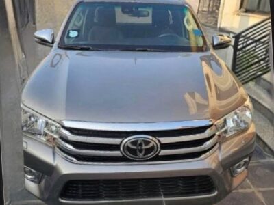 Image 1: Front view of the metallic silver 2017 Toyota Hilux Revo parked in Addis Ababa showing its pristine chrome grille and bumper guard