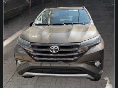 1:2022 Toyota Rush Bronze Mica Metallic front view showing chrome grille and LED headlights on Megebeya