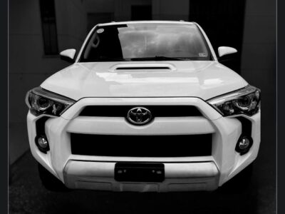 1: Front profile showing the iconic hood scoop and front grille.