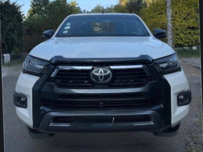 1.Front profile of a white 2021 Toyota Hilux Adventure featuring an aggressive front bumper and grille in Addis Ababa