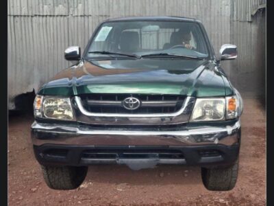 1:Front view of 2004 Toyota Hilux Extra Cab N170 in Imperial Jade Mica green with chrome bumper for sale on Megebeya Ethiopia