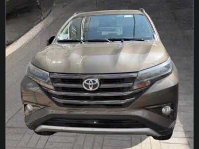 1:Front view of 2022 Toyota Rush S-Trim compact 7-seater SUV in Bronze Mica Metallic color for sale on Megebeya